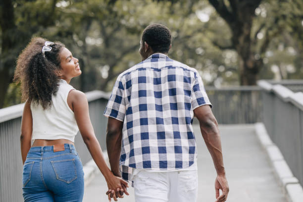 Couple holding hands while walking